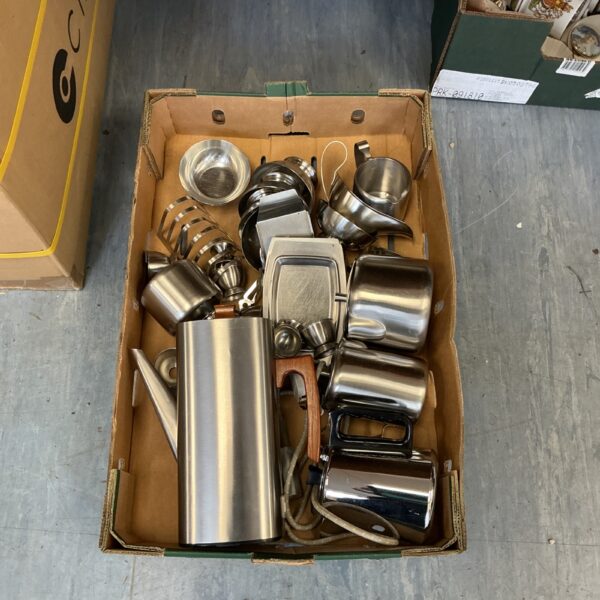 Vintage stainless steel tableware set with coffee pot and teapot.