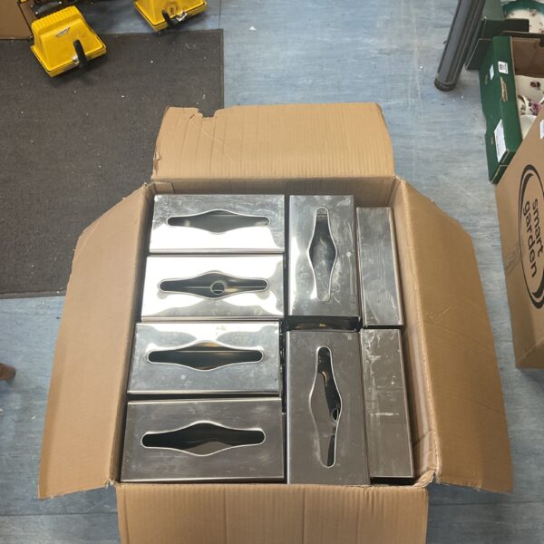 Stainless steel tissue dispenser inside cardboard box.