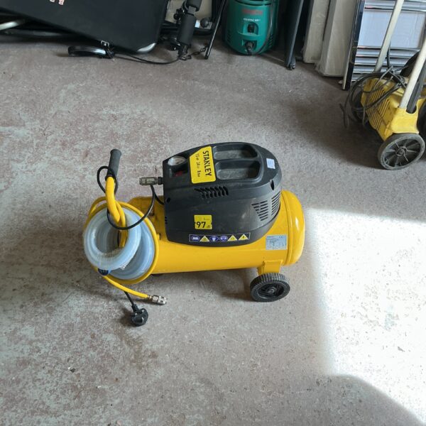 Portable Stanley air compressor with black and yellow casing.