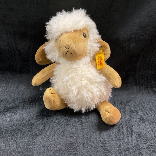 Vintage Steiff sheep toy with tag, front view.