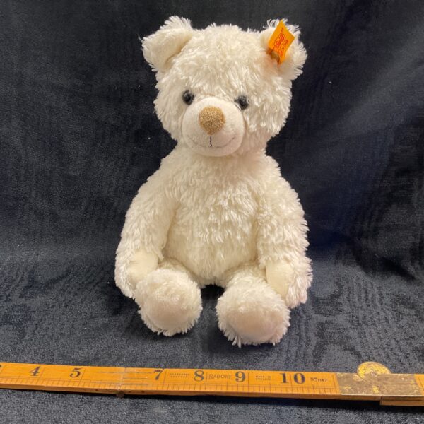 Vintage Steiff white teddy bear with button and label.