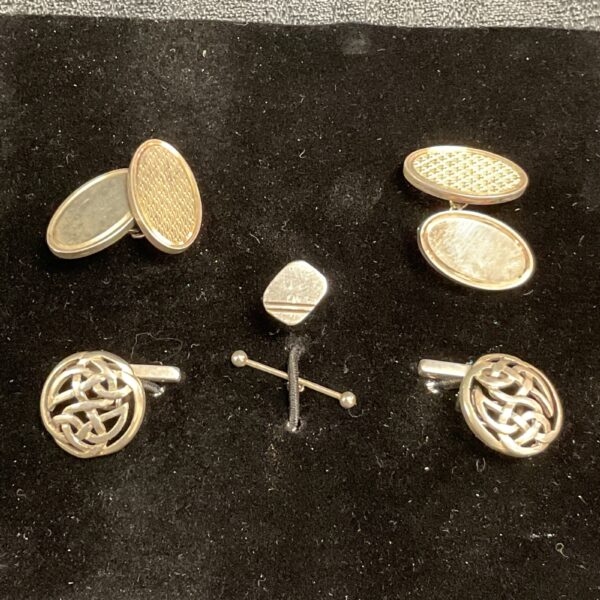 Vintage sterling silver cufflinks and tie stud set for formal wear.