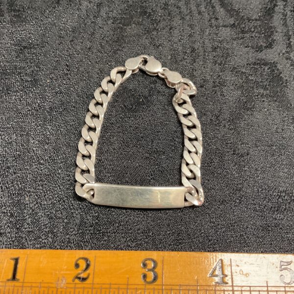 Vintage sterling silver ID bracelet with curb chain design.