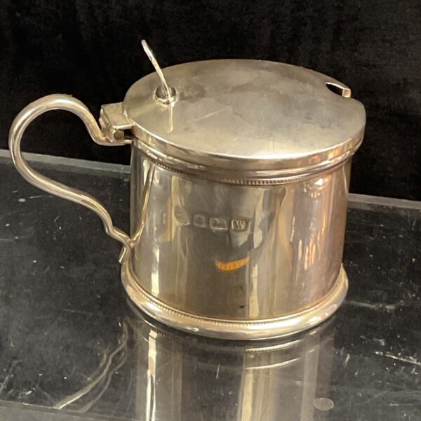 Antique sterling silver mustard pot with hinged lid.