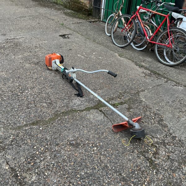 Used Stihl petrol strimmer for garden maintenance and landscaping.