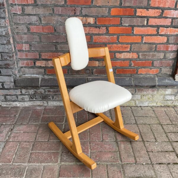 Vintage Peter Opsvik Stokke pendulum chair with white upholstery.