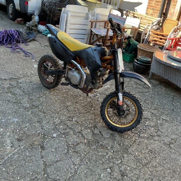 Used Stomp Scrambler motorbike for sale, showing side view.