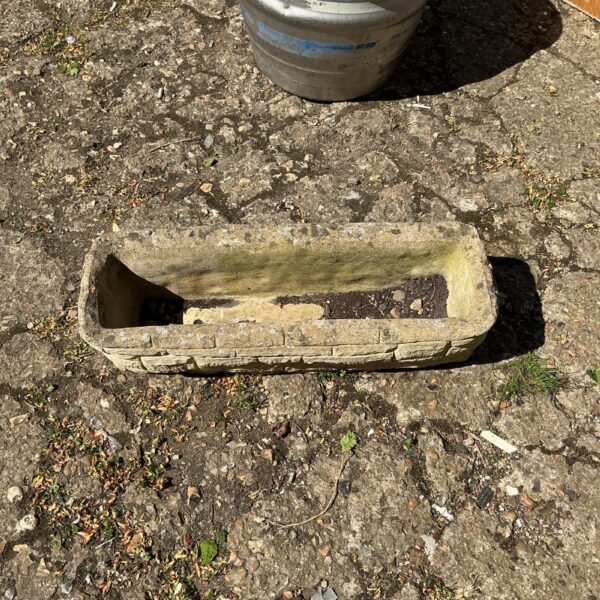 Small stone effect garden planter for outdoor plants.