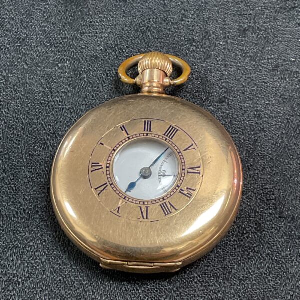 Vintage Syren pocket watch with a half hunter case and Roman numerals.
