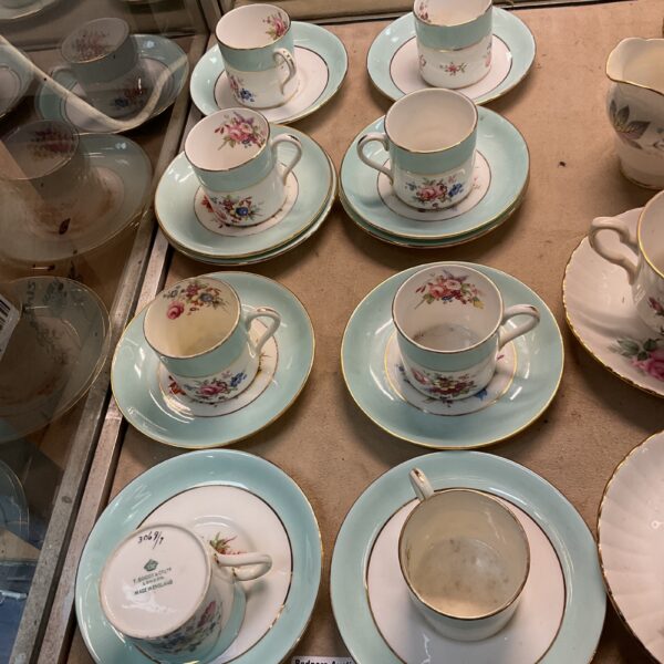 Vintage T. Goode & Co floral coffee cups and saucers on display.