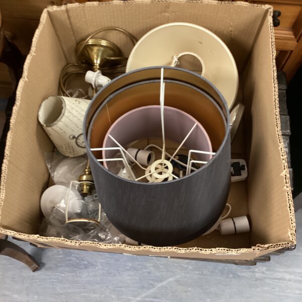 Vintage table lamps with assorted shades in a cardboard box.