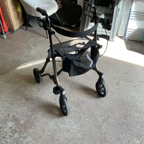 Taima walking assistance trolley with a padded seat.