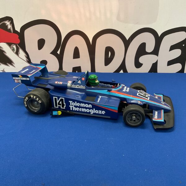 Vintage Tamiya Toleman Group F1 RC car in detailed condition.