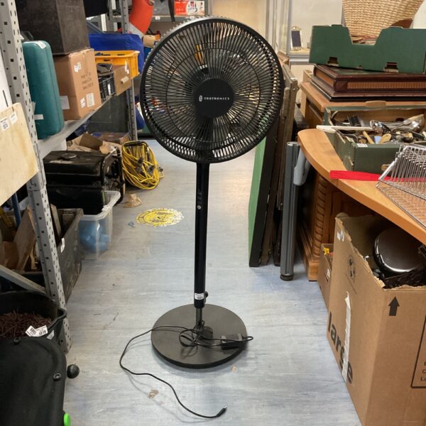 Black Taotronics pedestal fan with adjustable height and oscillation.