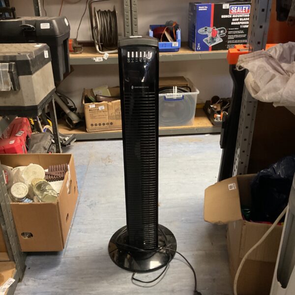 Black Taotronics tower fan for cooling and air circulation.