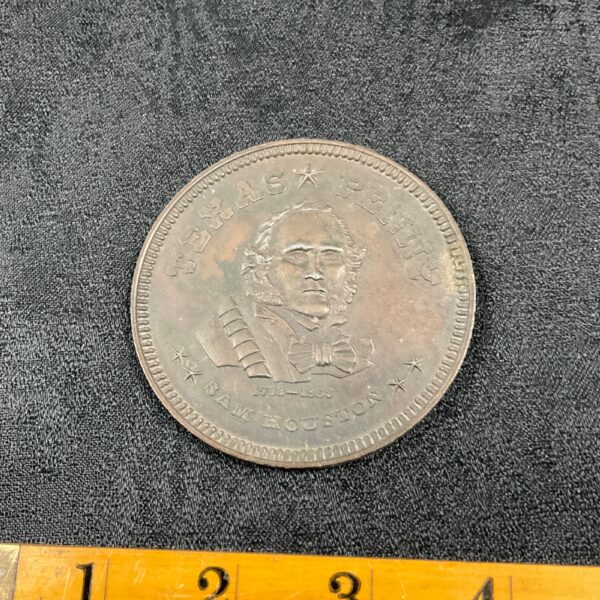 Vintage Texas penny featuring Sam Houston portrait.
