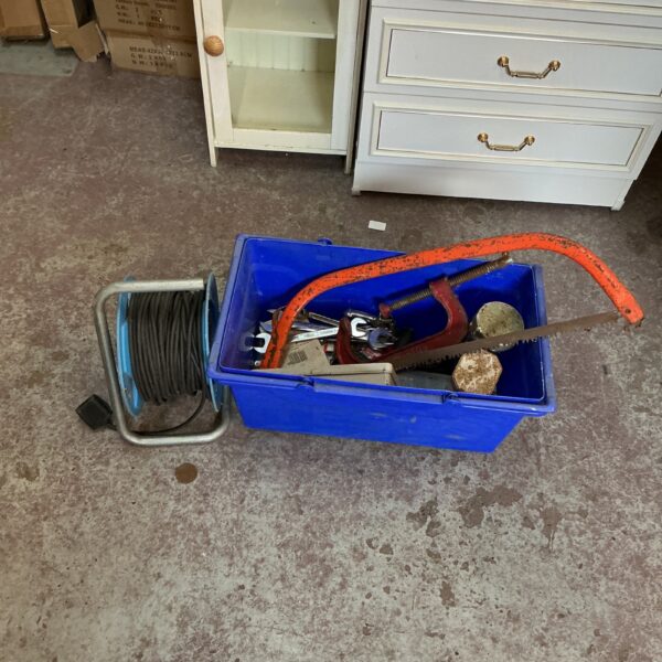 Assorted hand tools inside a plastic tool box.