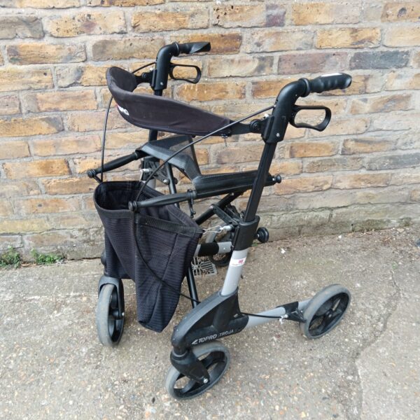 Silver Topro Troja mobility walker with shopping bag.