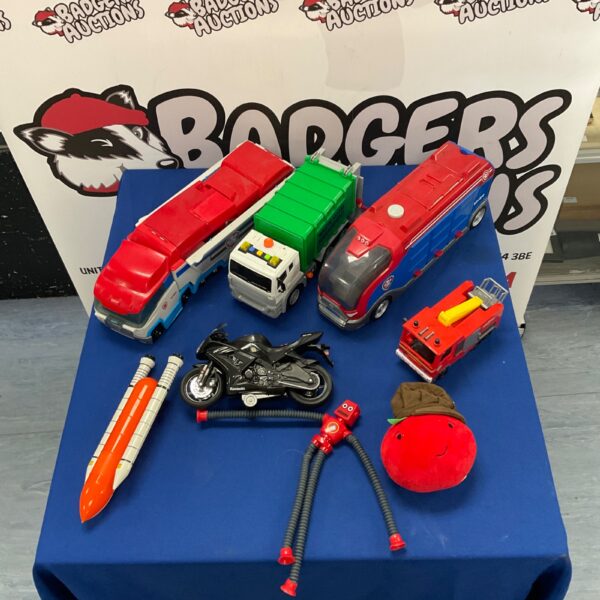 Mixed lot of vintage toy trucks and a Kawasaki motorcycle.