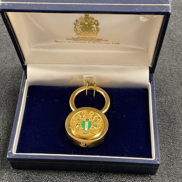Gold-tone Toye Kenning and Spencer keyring presented in a fitted box.
