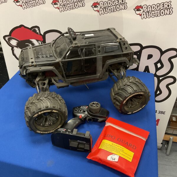 Large scale Traxxas RC buggy with remote control, ready for off-road adventures.
