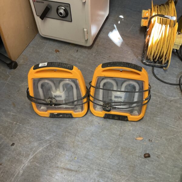 Two used portable site lights for construction and outdoor work.