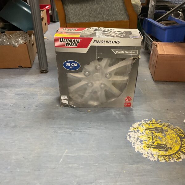 Ultimate Speed 15 inch wheel trims in original packaging.