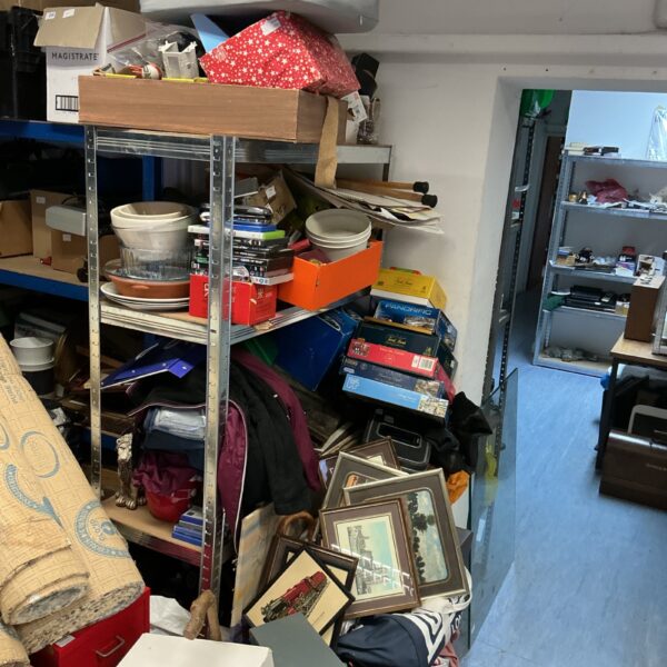 Assorted unclaimed items in a mixed lot for charity.