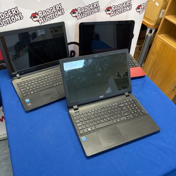 Front view of a used Acer laptop in a lot.