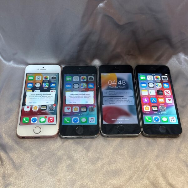 Lot of four used iPhones for parts or repair.