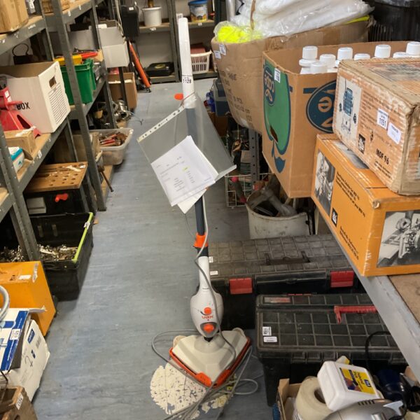 Used Vax Platinum Smartwash Pet Design carpet cleaner in a cluttered space.