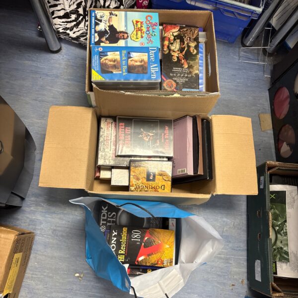 Mixed lot of VHS and cassette tapes for collectors.