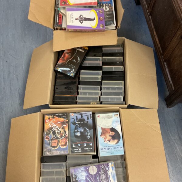 Lot of vintage VHS movie tapes for collectors and film enthusiasts.