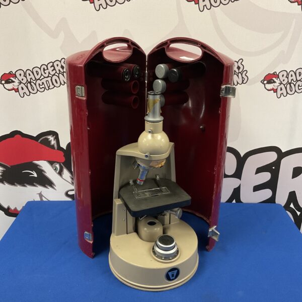 Front view of a vintage Vickers laboratory microscope.