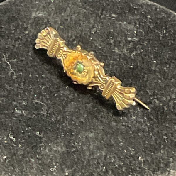 Victorian 9ct gold brooch with green stone detail.