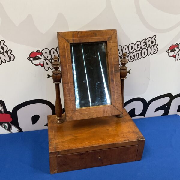 Antique Victorian bachelors mirror with mahogany finish.
