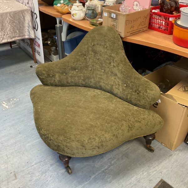 Antique Victorian bell back chair with patterned upholstery.