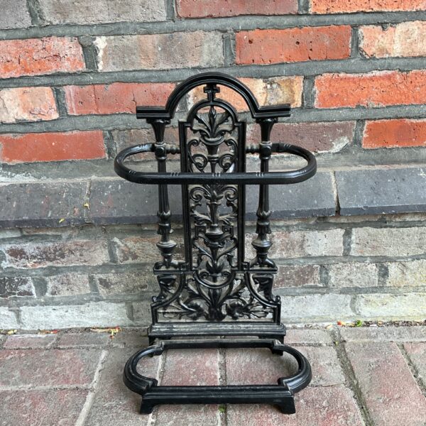 Intricate Victorian cast iron umbrella stand for hallways.