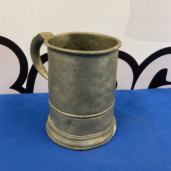 Large Victorian pewter tankard with a classic design.