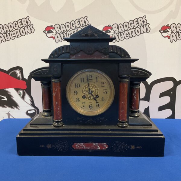 Victorian slate mantle clock with marble details and Roman numerals.