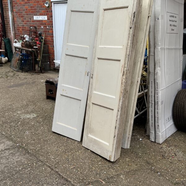 Pair of antique Victorian window shutters with panelled design.