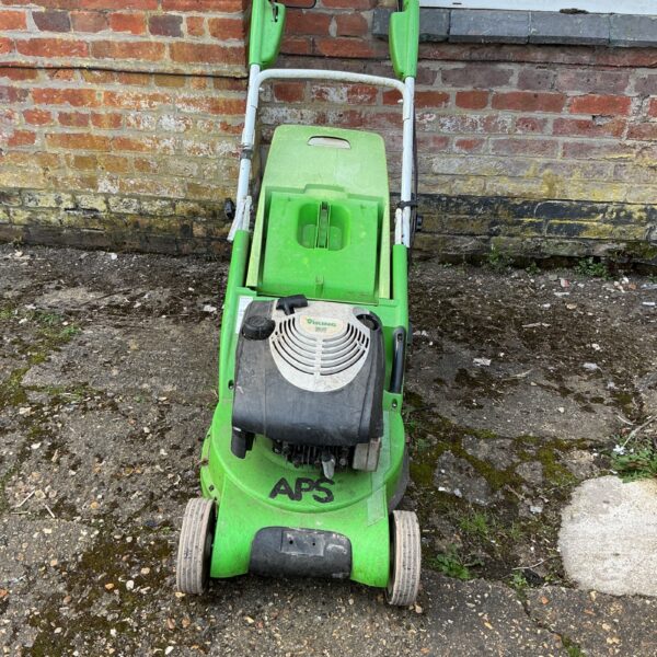 Green Viking petrol lawnmower in used condition for garden maintenance.