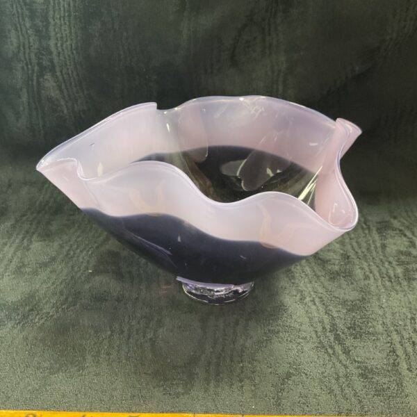 Side view of a vintage A Gilles Jones purple glass vase.