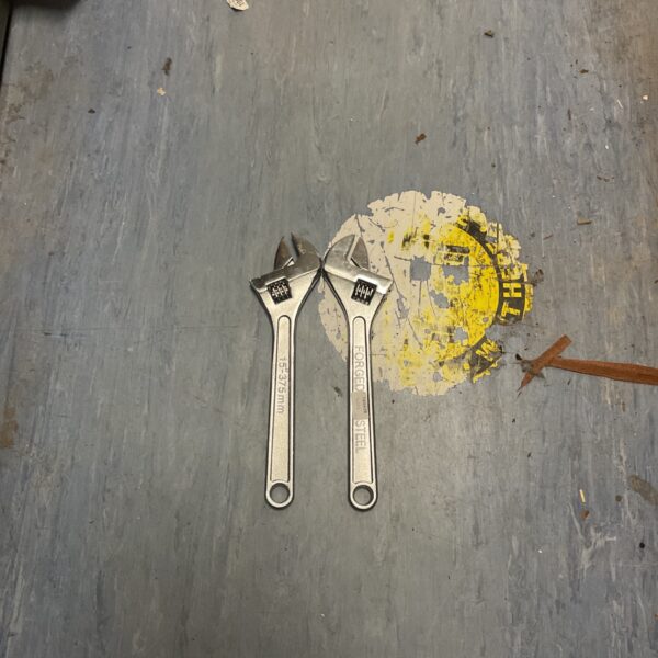 Vintage 15 inch adjustable steel wrench for workshop or collection.