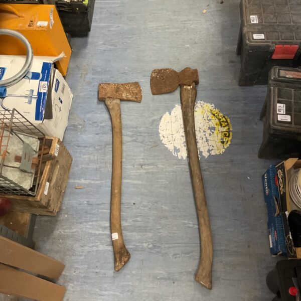 Vintage axe with a hickory handle, showing signs of age.
