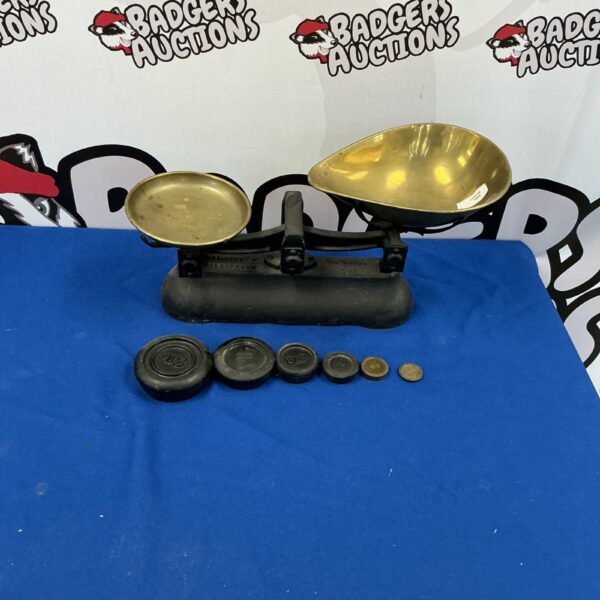 Vintage balance scales with weights for accurate measurement.