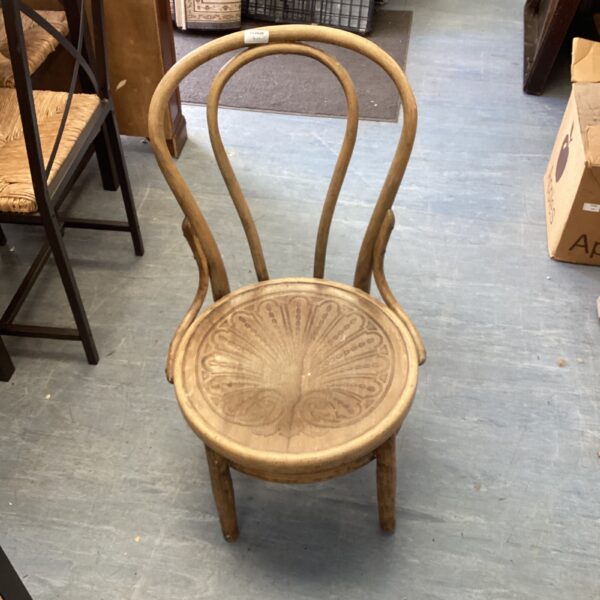 Vintage bentwood nursing chair with curved back and shaped seat.