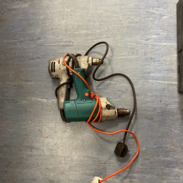 Vintage Black and Decker corded drill in used condition.
