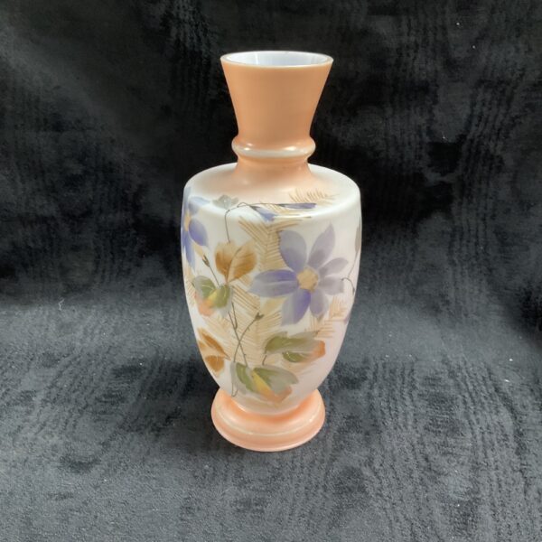 Vintage blush pink vase with hand-painted purple flowers.