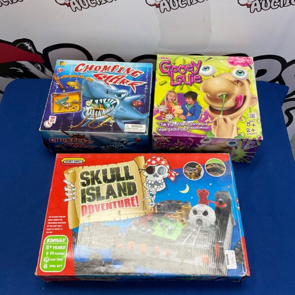 Vintage board games lot including Gooey Louie and Skull Island Adventure.